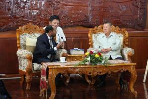 UN-SPIDER officer Shirish Ravan with the Minister of Agriculture of Lao PDR